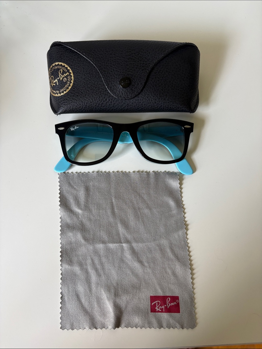Ray-Ban Black Frame Sunglasses with Light Blue Temples